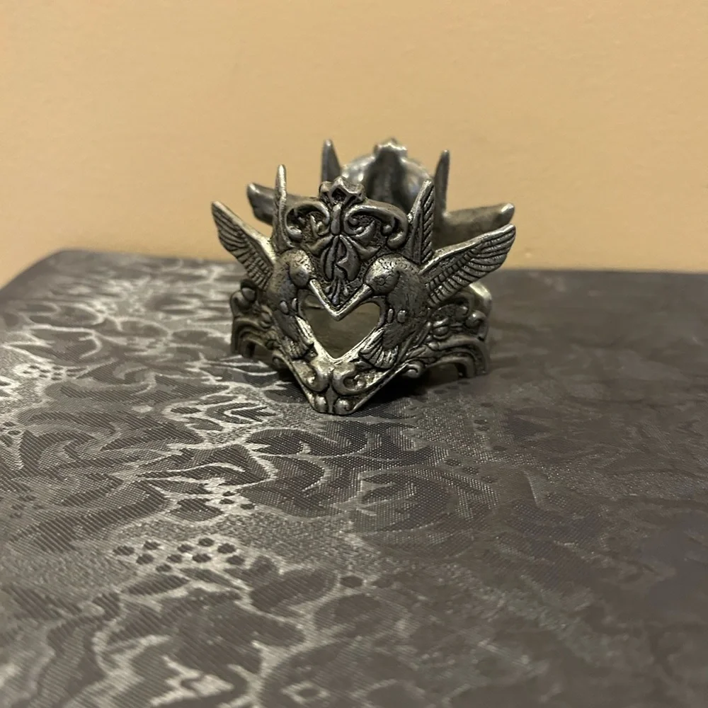 Pewter candle holder features hummingbirds and hearts